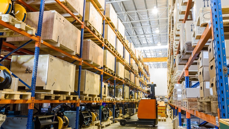 Organised warehouse shelving used to represent product sourcing and consolidation